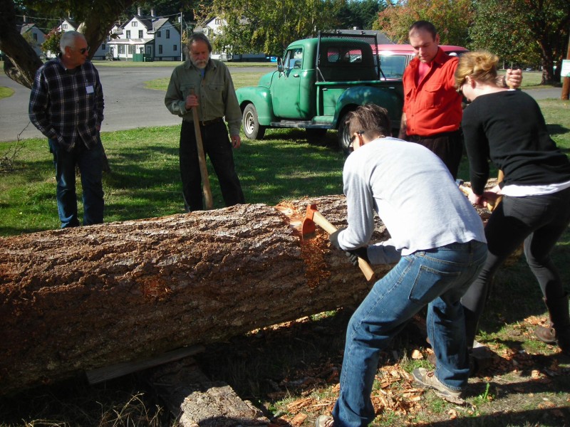 Removing bark before sawing the log